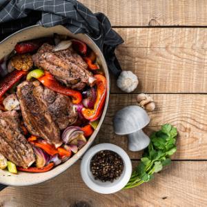 Baked lamb with vegetables and red wine sauce